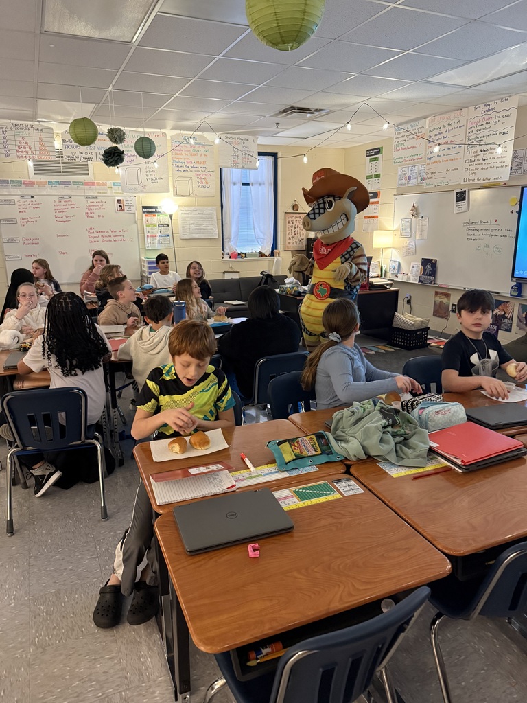 Ms. McAllister's and Ms. Taylor's class got to have their Perfect Attendance Texas Roadhouse bread party today with Andy the Armadillo!