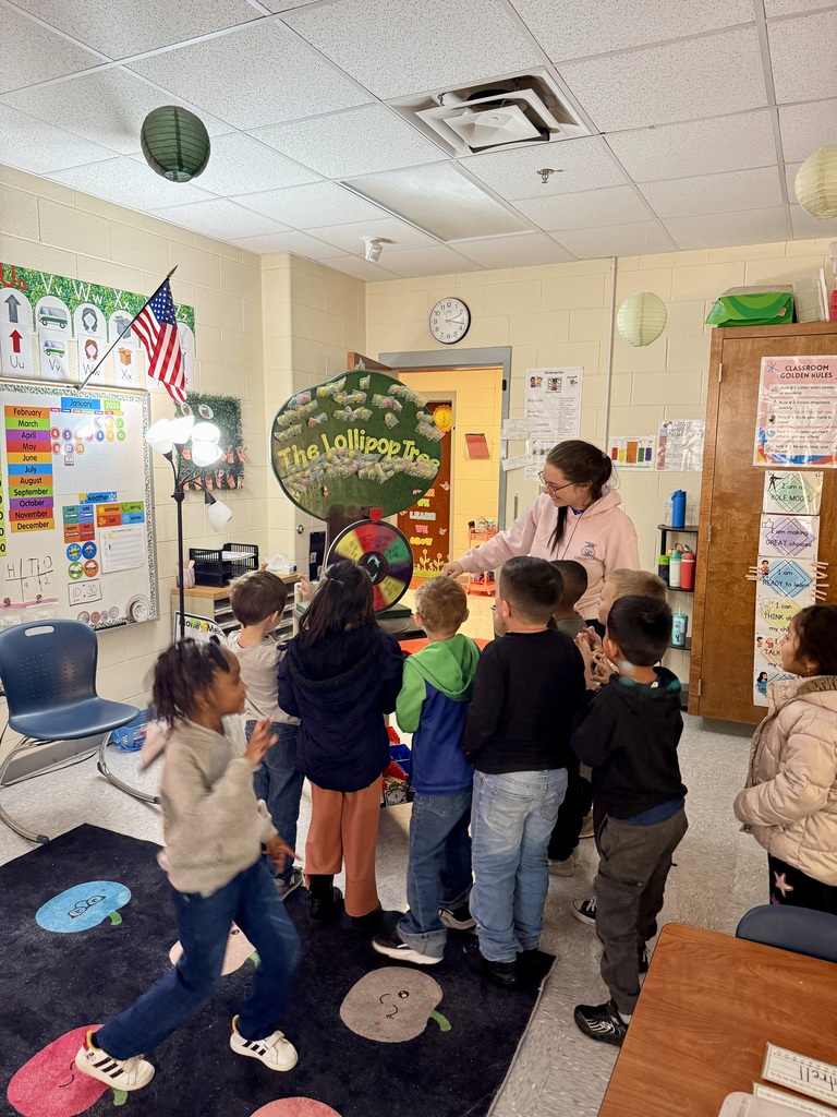 Ms. Estrada's class spelled perfect attendance and spun to win a bread party from Texas Roadhouse! They are super excited!