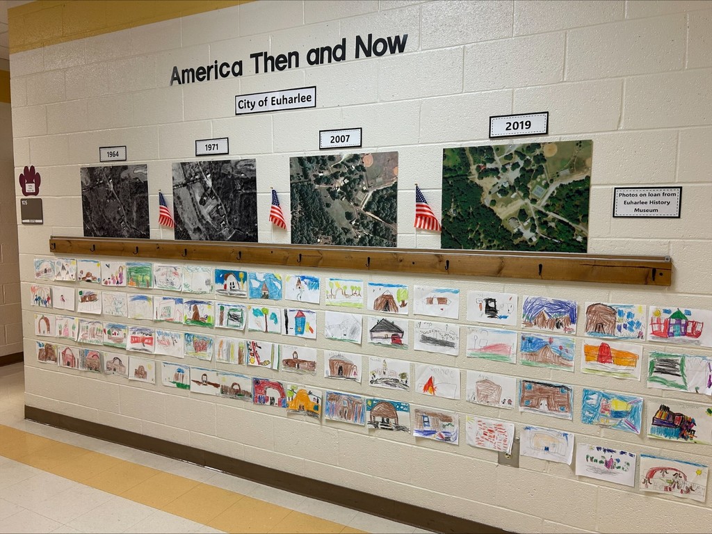 There is a caption that says, "America Then and Now".  There are aerial photos of the school.  Under those photos are student drawings.