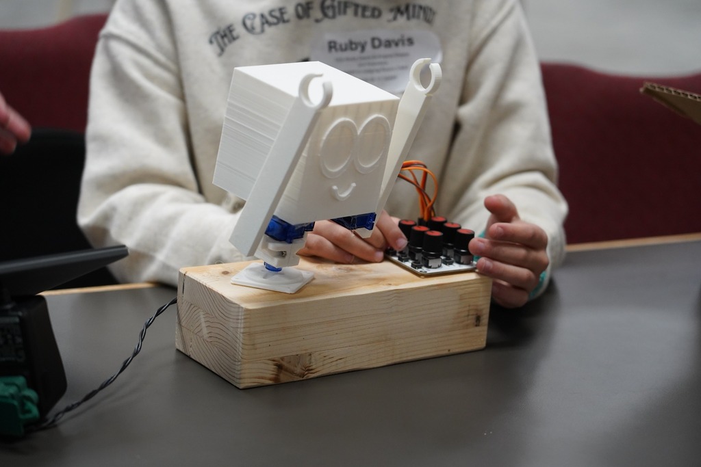 student working on technology project