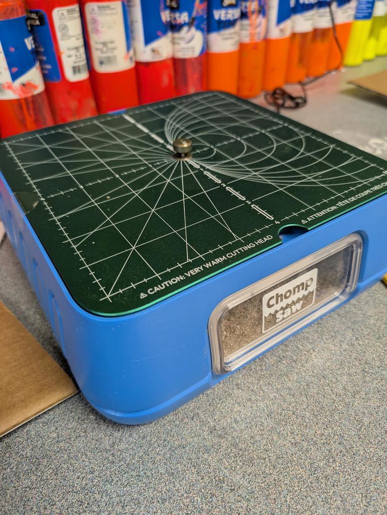 There is a picture of a ChompSaw.  It is blue with a green guide on the top.