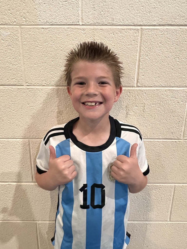 A photo of 3rd grader Gareth, who is smiling because he set the new school record for the Boy's Pacer Test at 66 laps!