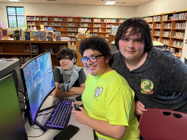 3 students at a computer
