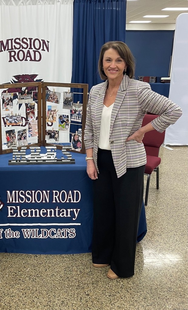 MRES Assistant principal smiling for a picture at the job fair. 