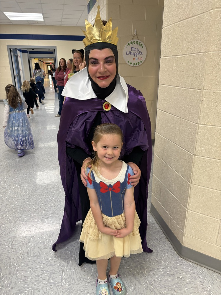 Mrs. Bennett dressed as the wicked queen with a student dressed as Snow White 