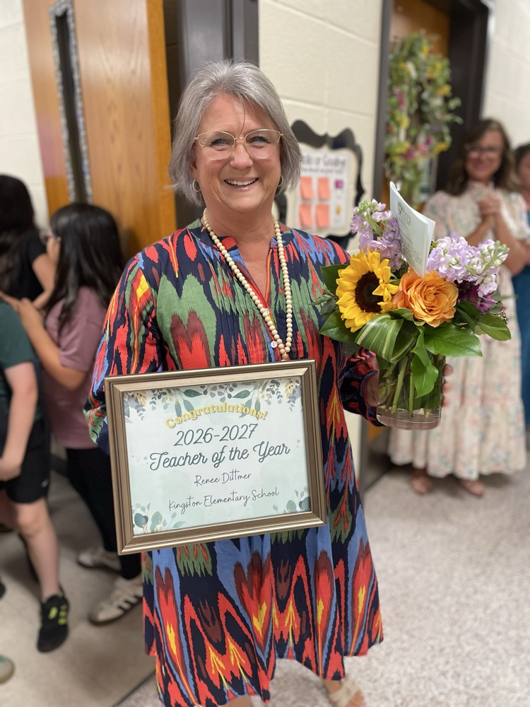 Mrs. Dittmer with her certificate and flowers  