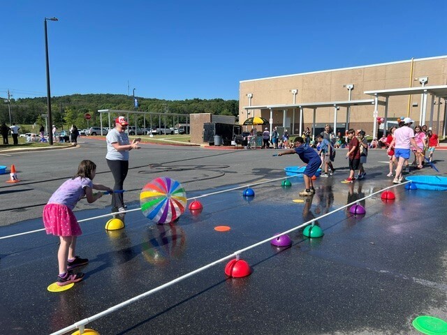Students playing a water game on Field Day.