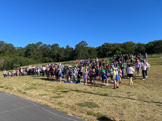 3rd through 5th grade students waiting on the hill for Field Day to start.