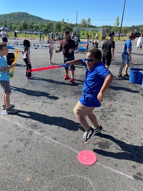 A student dancing during field day. 