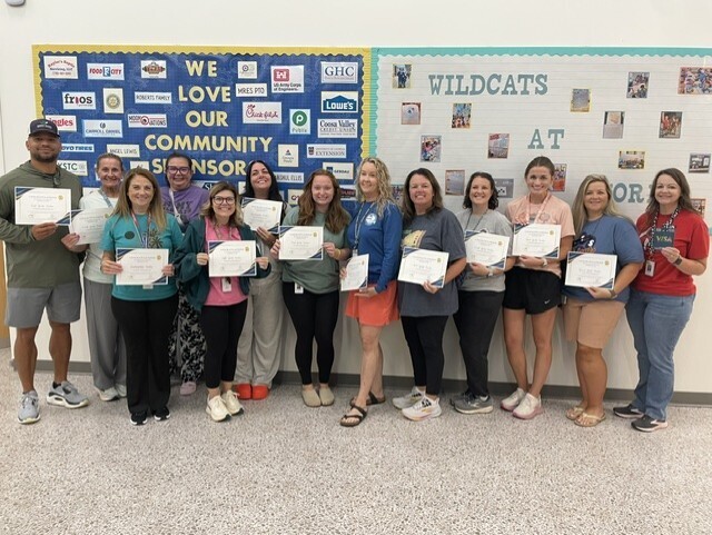 Atco Baptist Church sponsored a breakfast for our staff. Teachers won gift certificates to use in their classrooms. The teachers are smiling for a picture. 