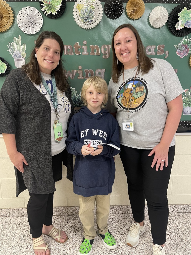 Dr. Payne, Ryan B. and Mrs. LaRue celebrating Ryan for his positive office referral.