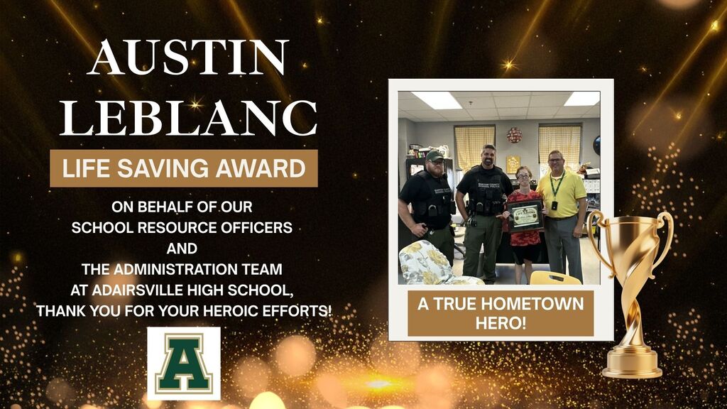 Black backdrop with gold accents shows "Austin LeBlanc" and "Life Saving Award". Image inset shows three people in uniforms, one holding an award. Trophy beside the text "A True Hometown Hero".
