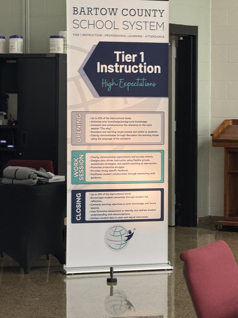 A tall banner for the Bartow County School System's Tier 1 Instruction. The banner is in a hallway.