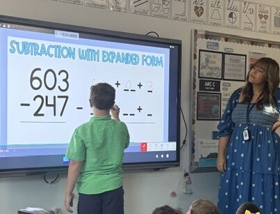 Mrs. Pinkard's class working on subtraction with expanded form.