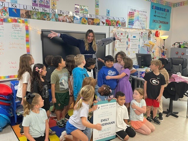 Ms. Zimmerman smiling with her students after receiving the news that she was BCSS Elementary Teacher of the Year.