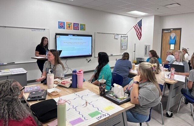 Teachers collaborating about math vocabulary language.