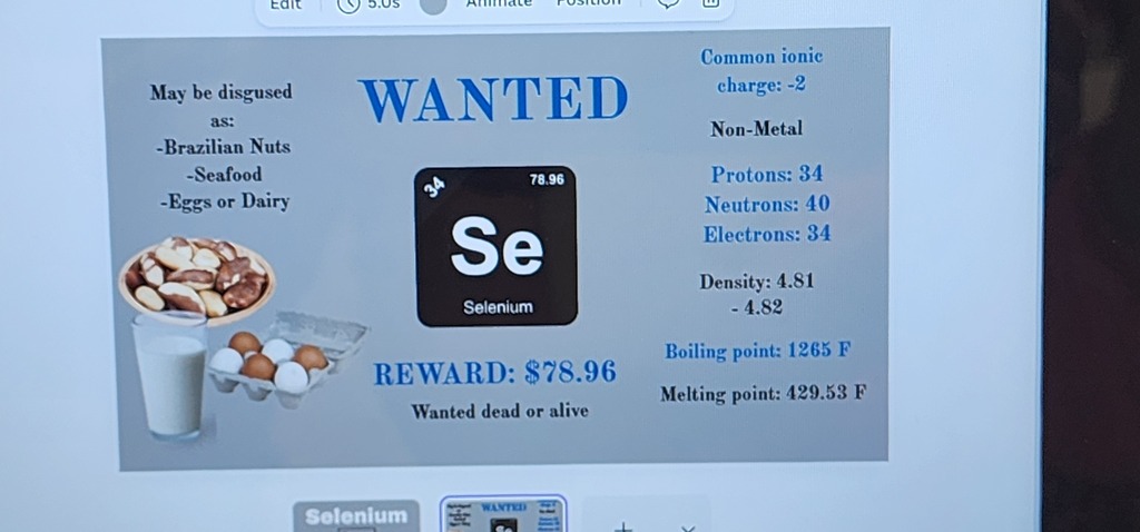 Display shows a wanted poster for selenium, including atomic number, melting point, and reward. The poster includes a bowl of food.