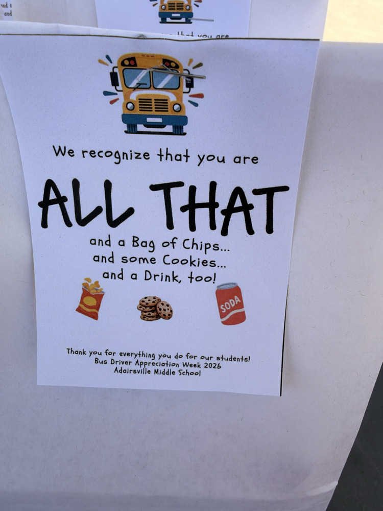 White sign with yellow school bus image, text "We recognize that you are ALL THAT and a Bag of Chips and some Cookies and a Drink, too!" with bag of chips, cookies, and soda.