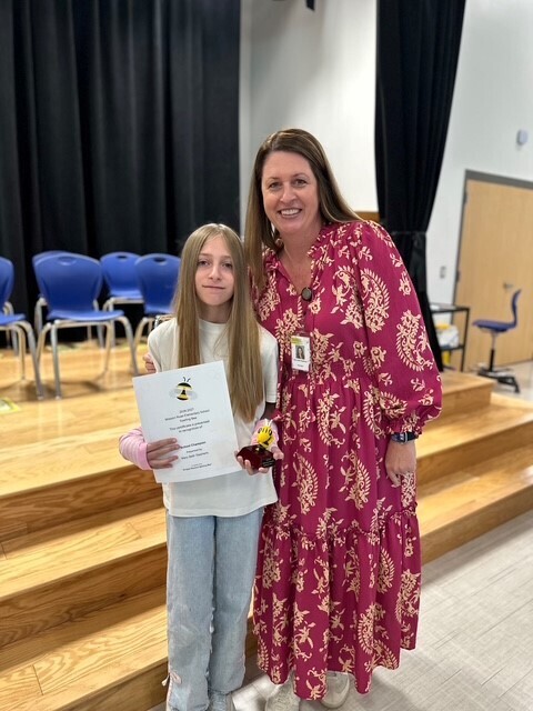 Matilda and Mrs. Stephens smiling for a picture after the Spelling Bee.