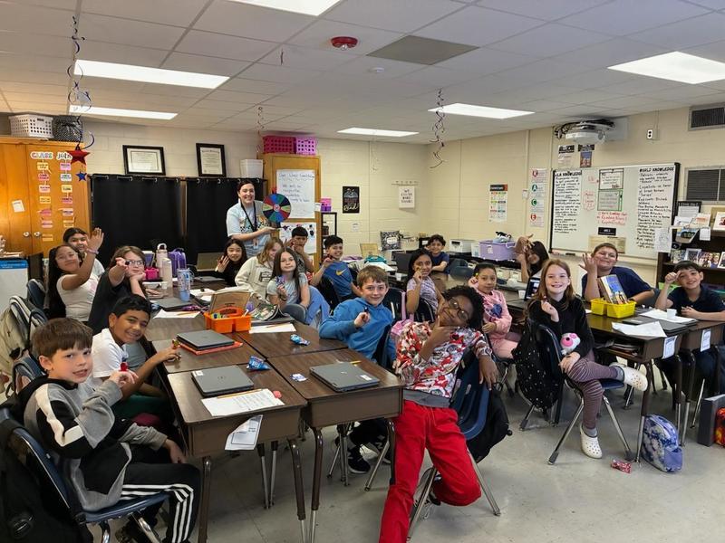 Mrs. Emerson's Homeroom spinning the attendance wheel.
