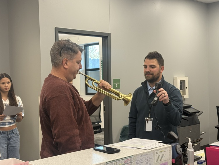 Mr. Smith playing Taps