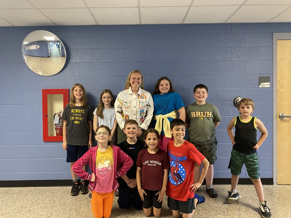 Miss Harbert wearing the jacket with her former students