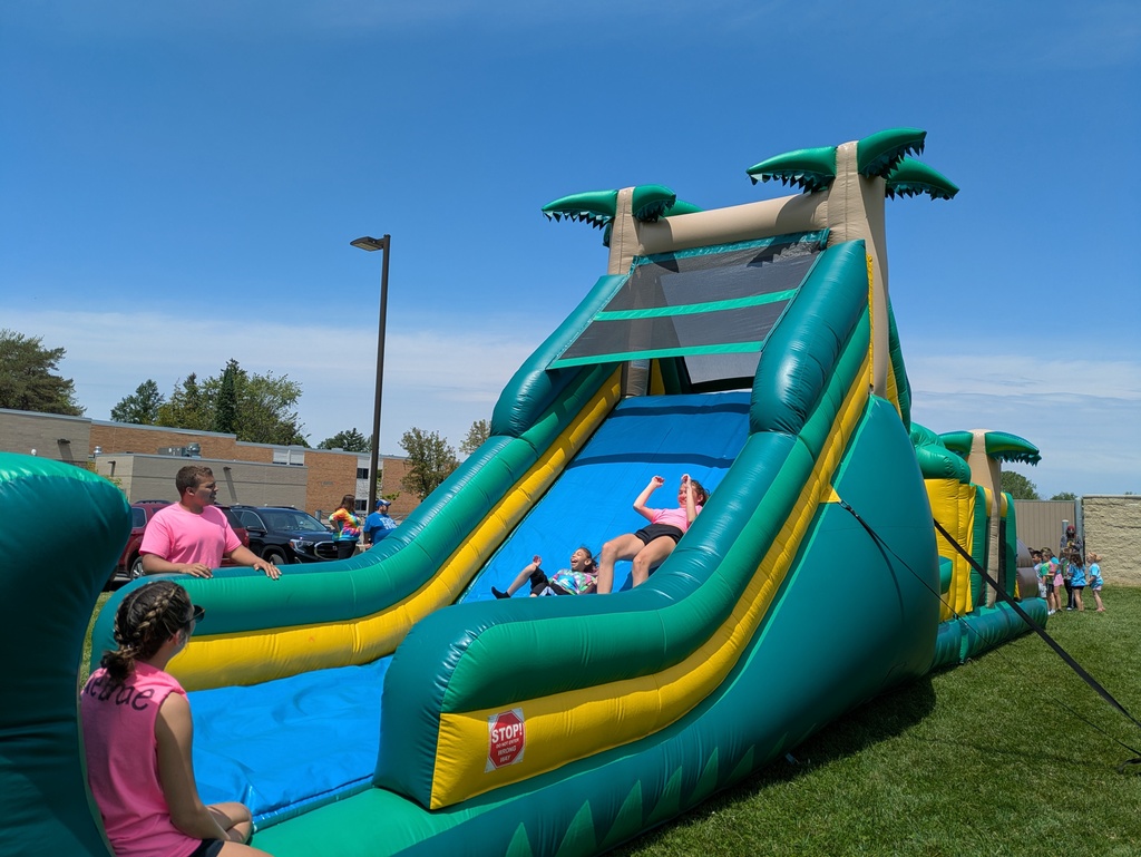 Students on inflatable obstacle course