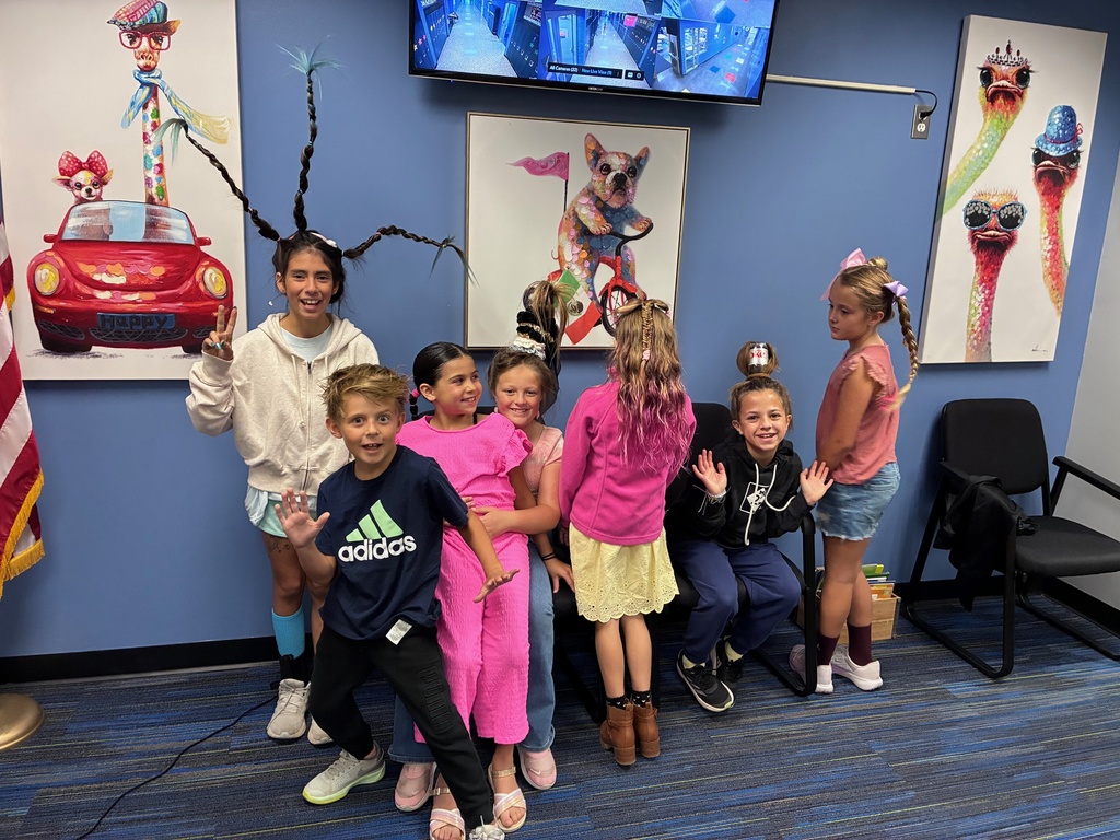 Crazy hair kids posing at the elementary