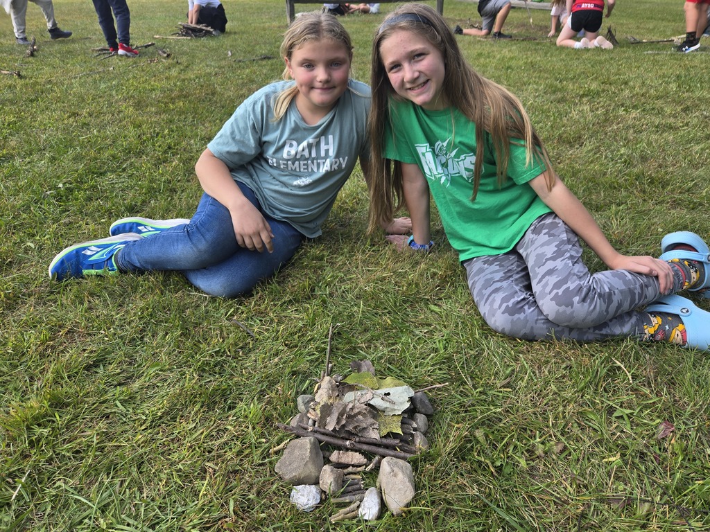 2 girls showing their project