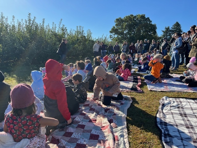 students sitting on blankets