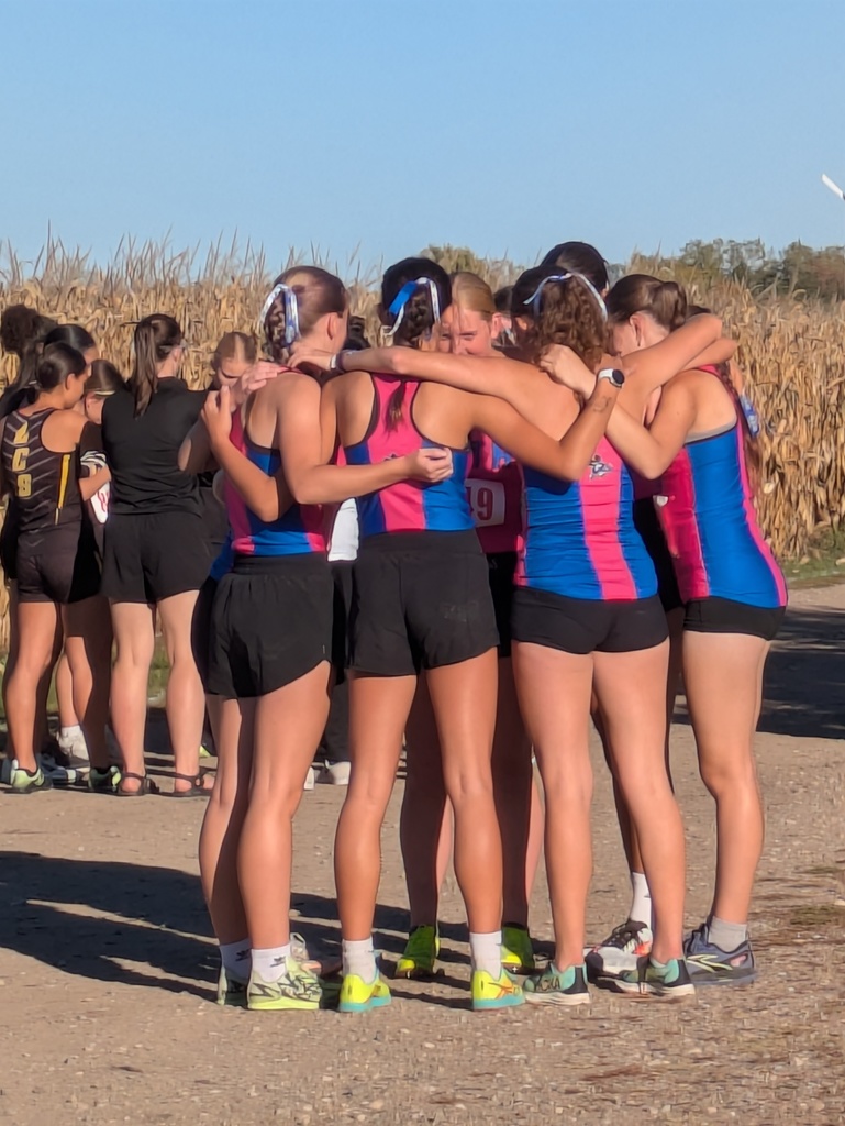 Girl team members in a huddle