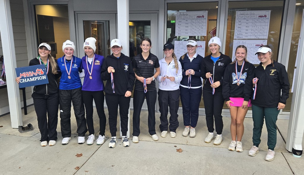 Girls golf team holding their medals