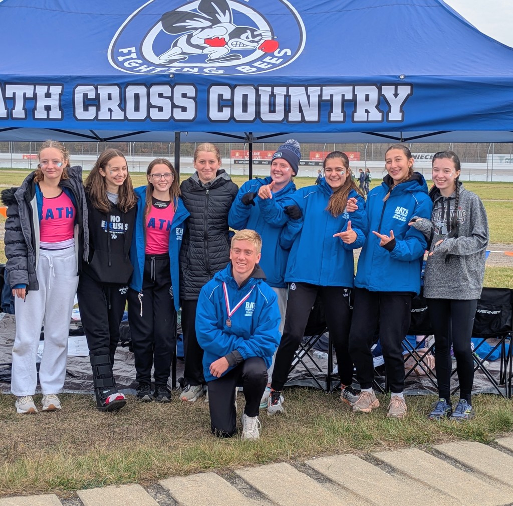 Cross country members in front of canopy