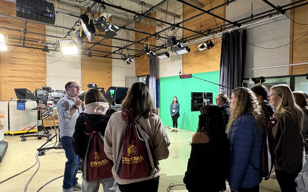 Students watching a green screen 
