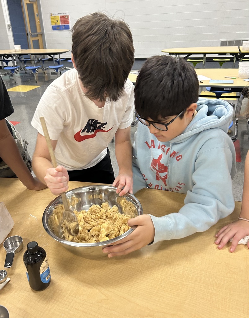 boys stirring cookie dough