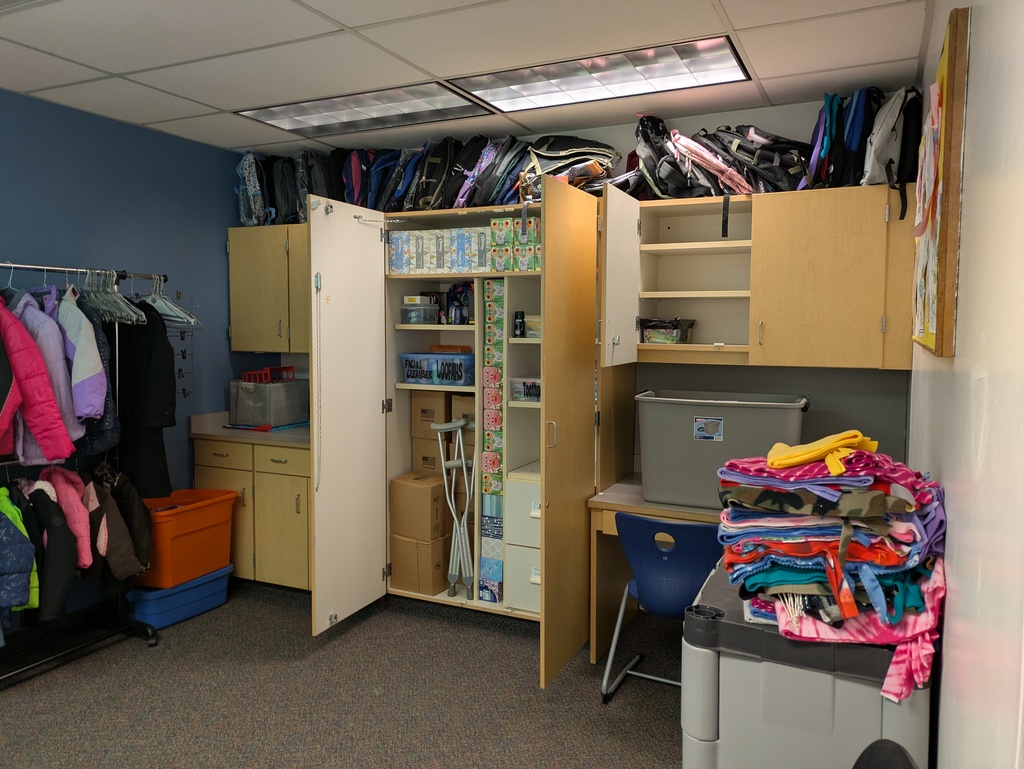 Open cabinets with supplies in them