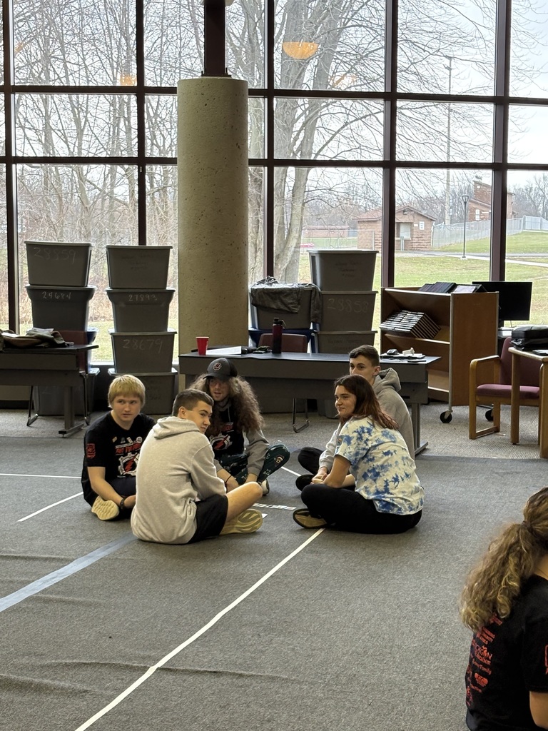 Students sitting on the floor