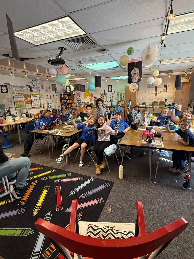 Students holding  cups of hot chocolate