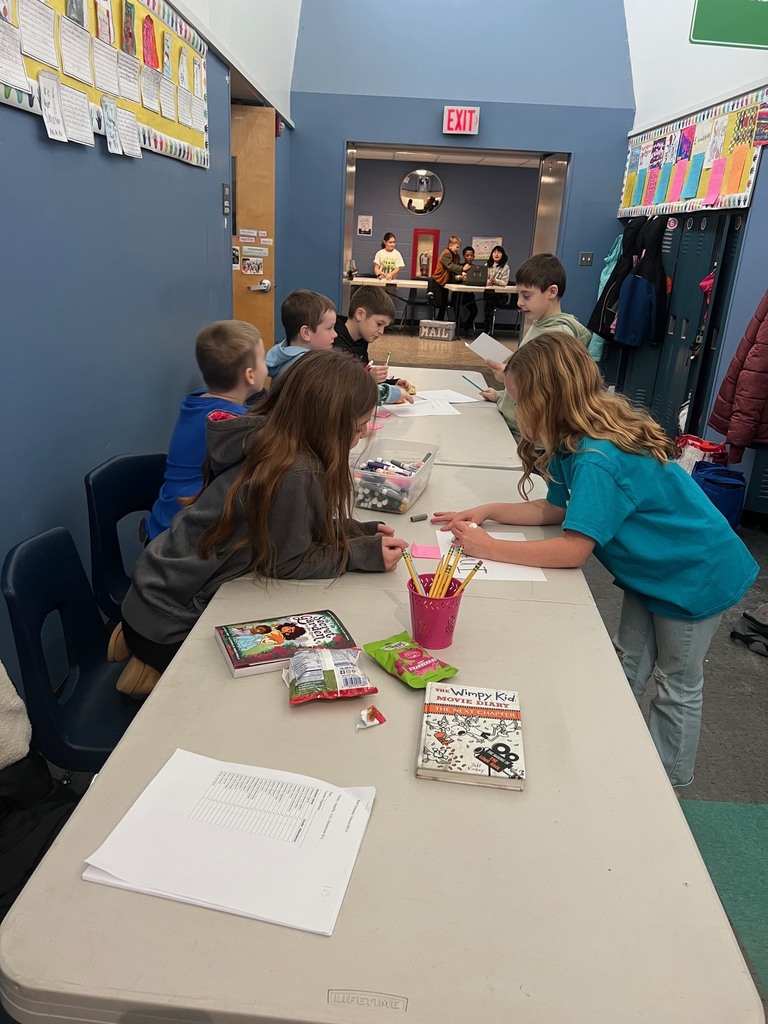 Students selling stamps and snack packs
