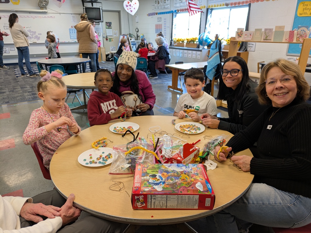 Students making necklaces