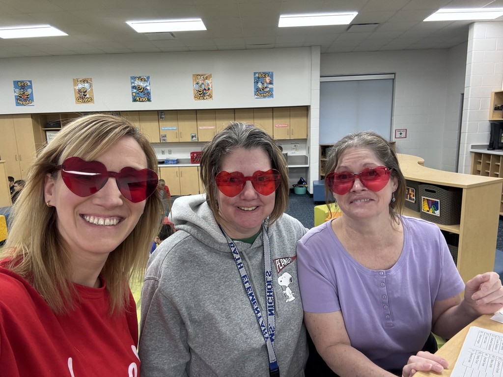 Beehive staff wearing heart glasses
