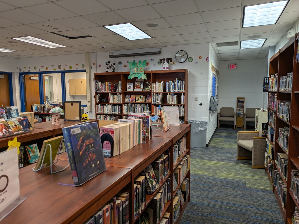 View of books on  shelves and reading nook