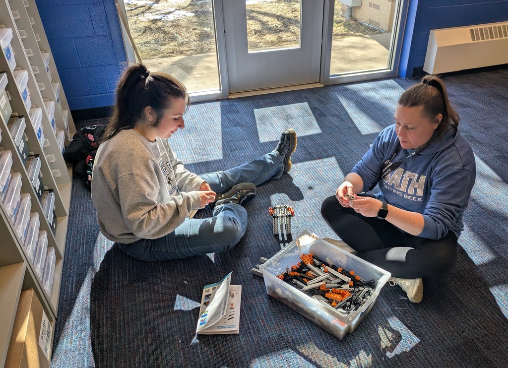 Ms. Helms and Mrs. Grennell with bridge construction kit