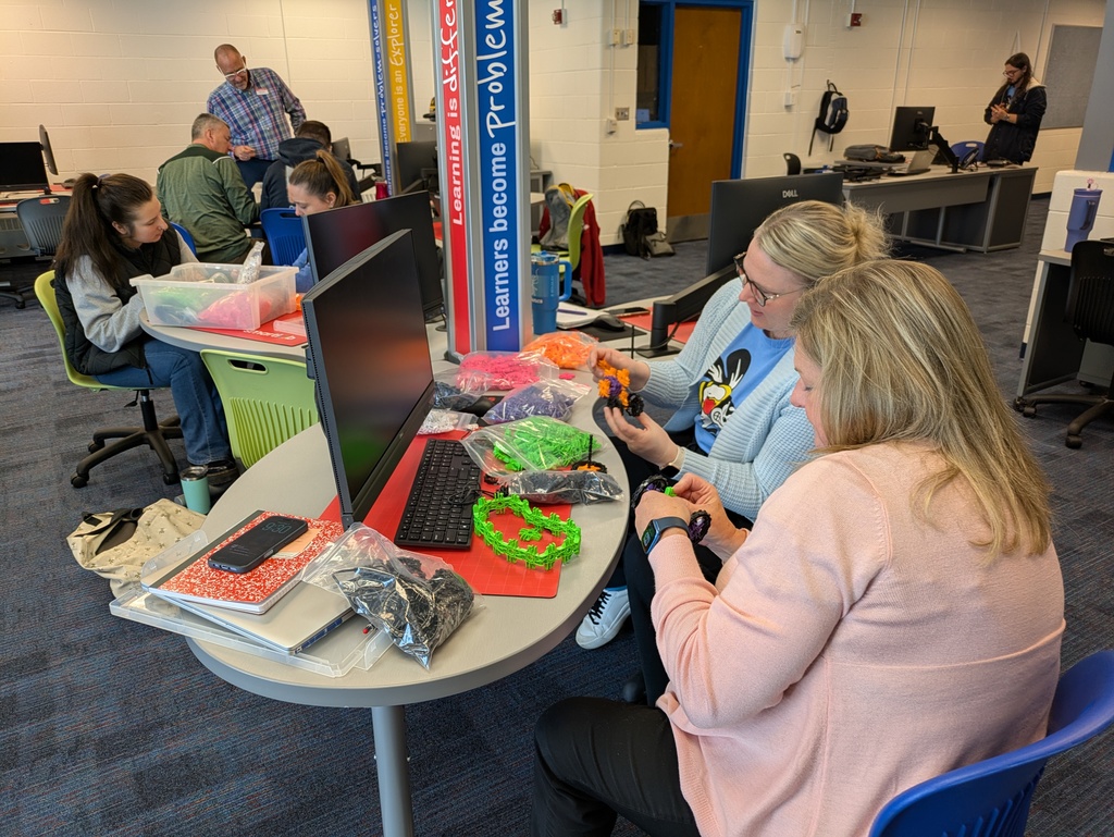 Staff using the building kits to make projects