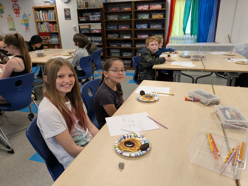 Girls sitting at a table