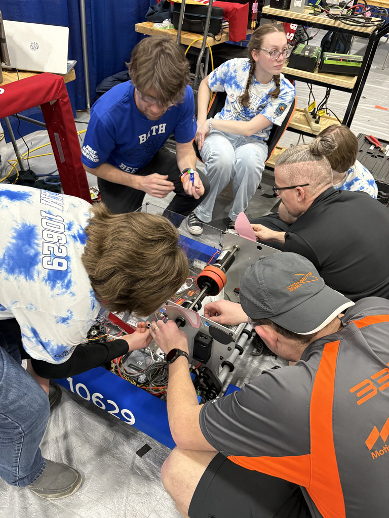 Team members working on their robot