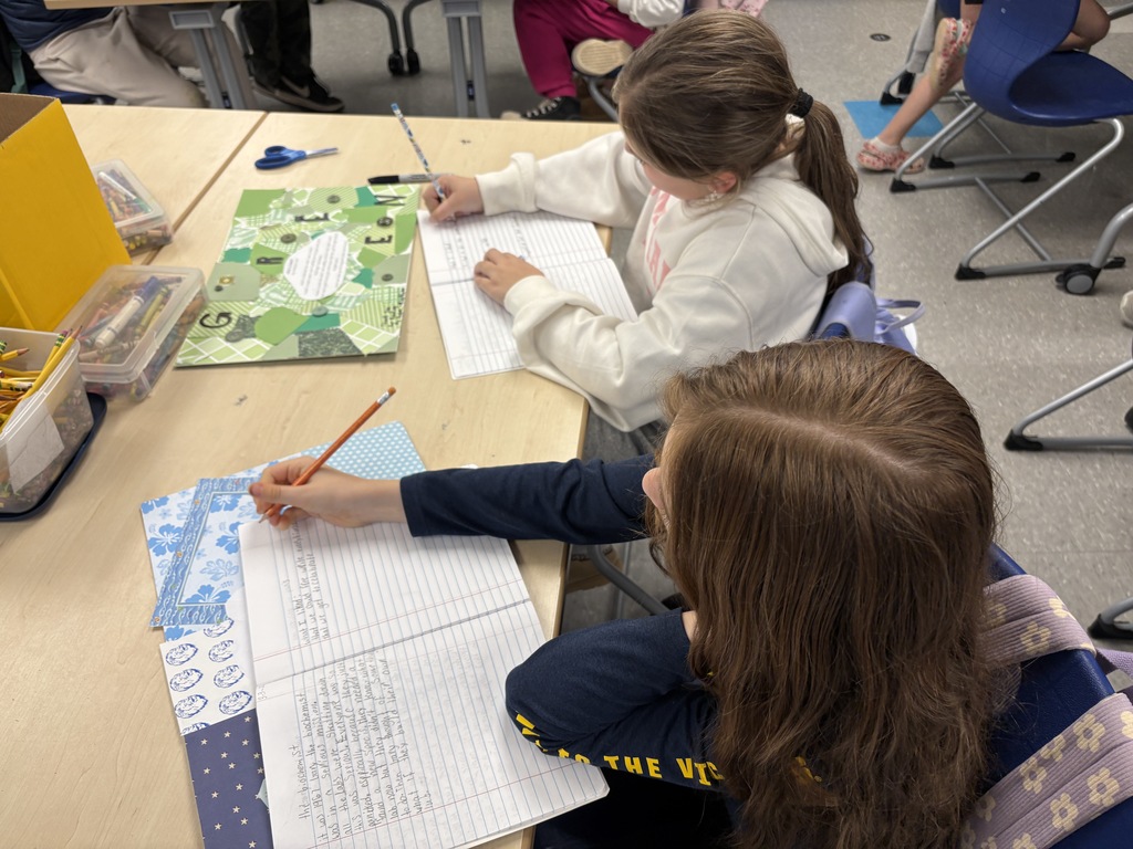 Girls writing in notebooks