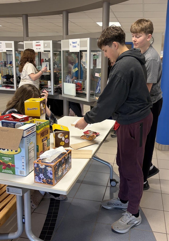 Boys buying snacks with their bee bucks