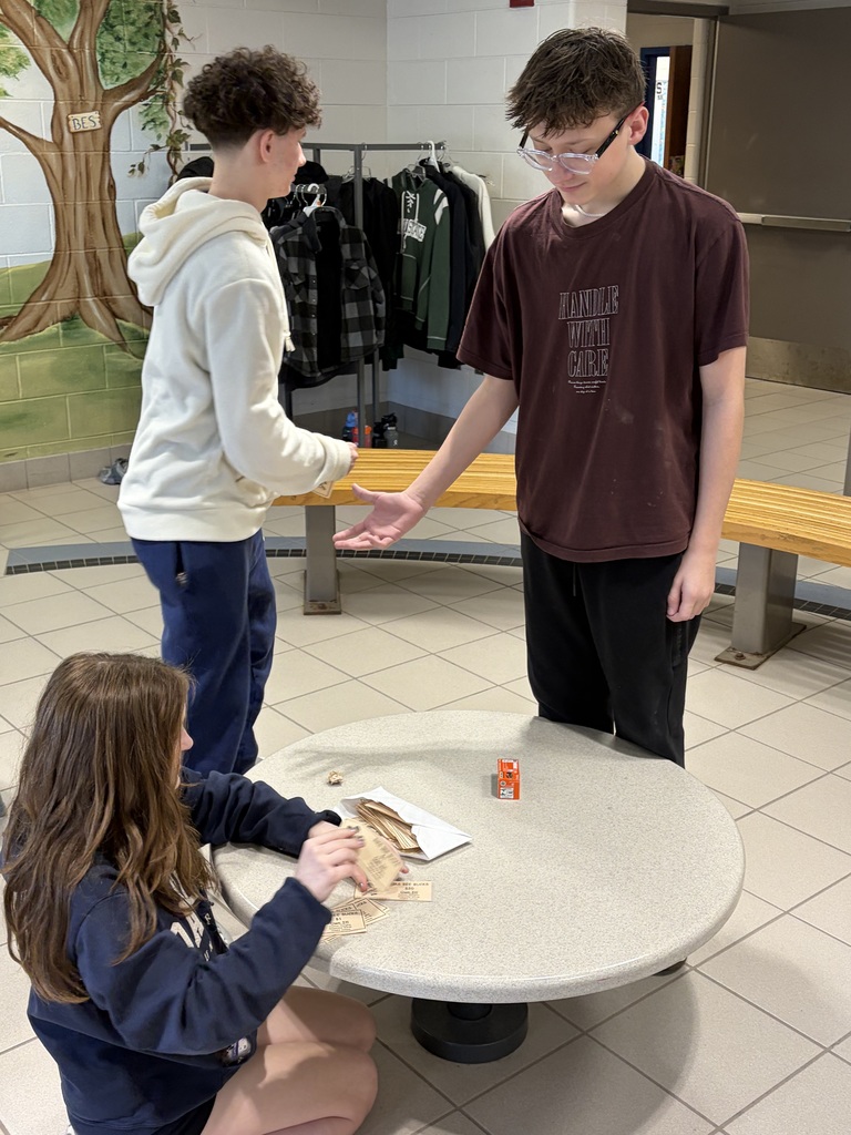 Boys buying items from the "Own IT" store