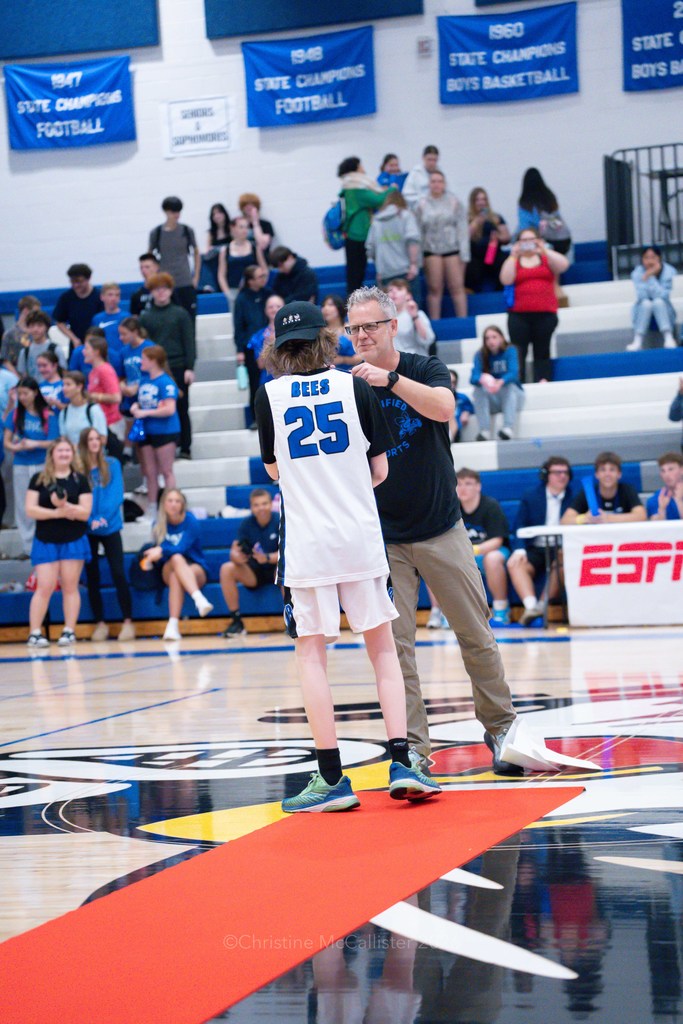 Athlete receives medal after game 